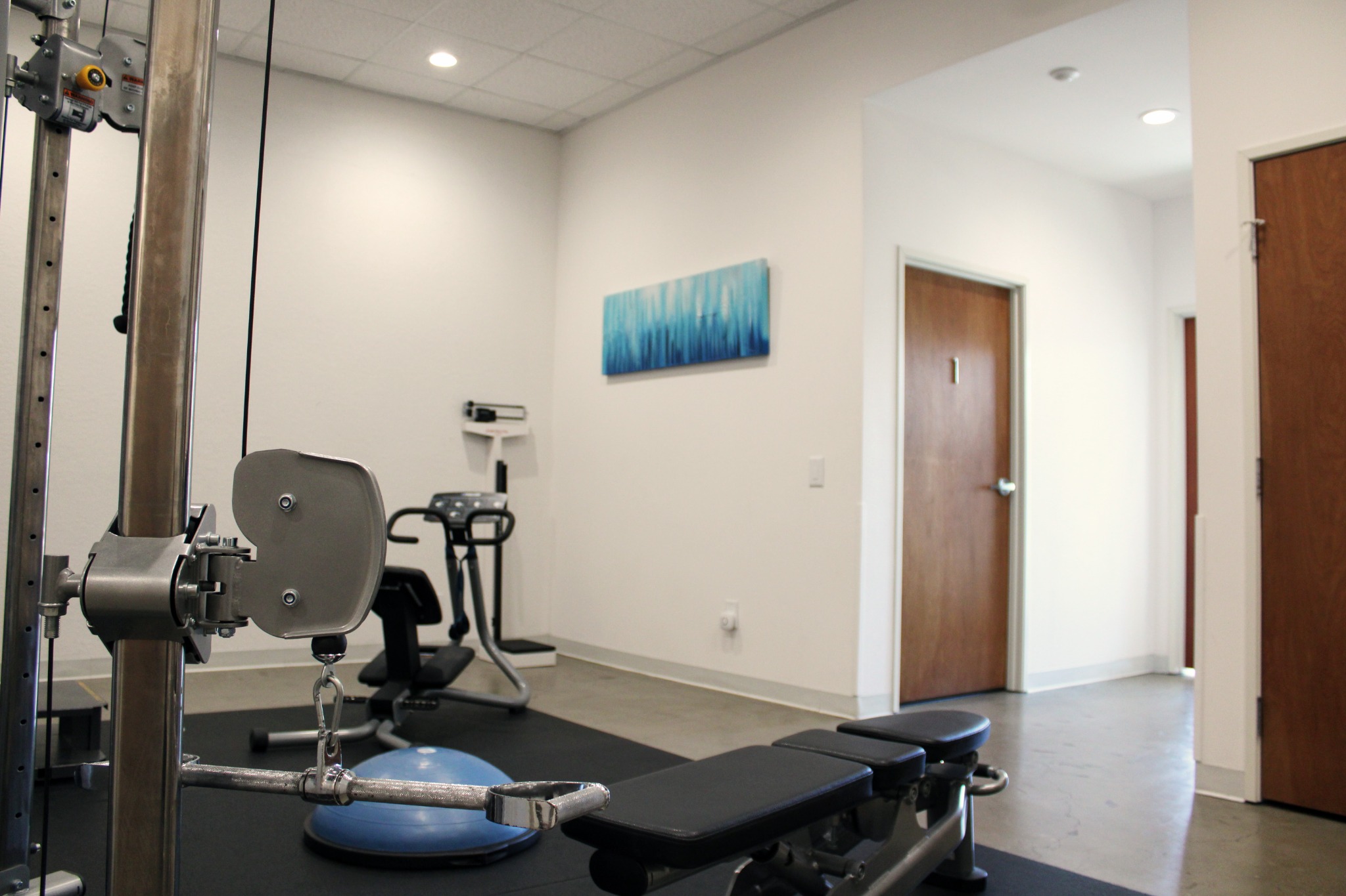 Exercise room with therapeutic equipment and a treatment table